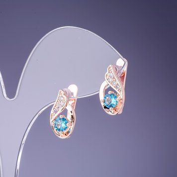 Сережки з блакитними кристалами 16х7мм золотистий метал 25742 фото