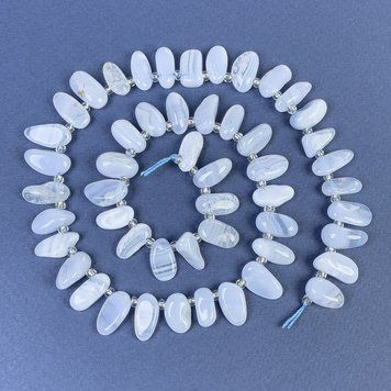 Бусины Агат голубой галтовка с бисером 6х12мм+- на нитке L-40см+- 70243 фото
