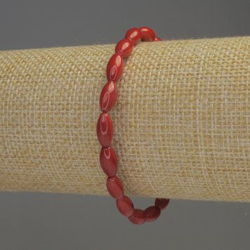 Браслет Коралл зерно d-10х5мм+- L- 18см стрейч 90083 фото